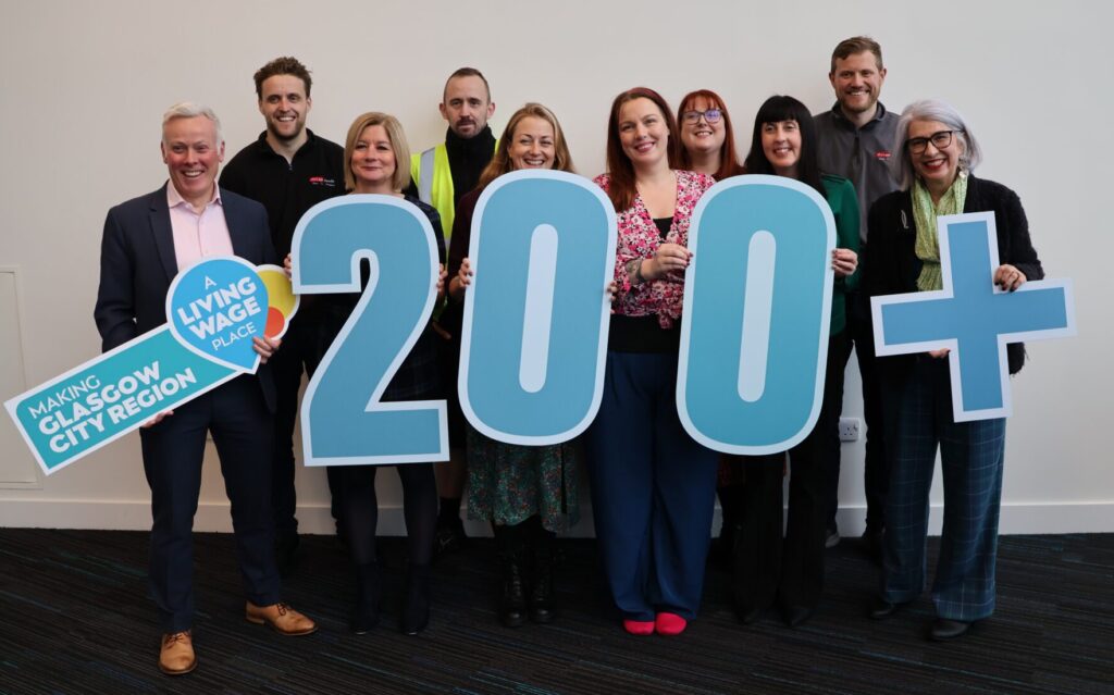 Glasgow City Region celebrates 200th new Living Wage accredited employer on the first anniversary of the Living Wage Place campaign. In the photo (left to right): Mike McNally, Head of Economic Delivery, Glasgow City Region; Andrew McLay, Director at McLays; Gillian Frew, Managing Director of Fat Buddha; Ryan Williamson, Driver at McLays; Val McNeice, Programme Manager – Health & Inclusive Economy, Glasgow City Region; Kylie Cunningham, Programme Management Officer, Glasgow City Region; Rachel Morrison-McCormick, Living Wage Projects Co-ordinator, Living Wage Scotland; Sheena McBeth, Living Wage Projects Officer, Living Wage Scotland; Mark McLay, McLays; and Professor Rosalind Searle, Professor of Human Resource Management & Organisational Psychology at the University of Glasgow.